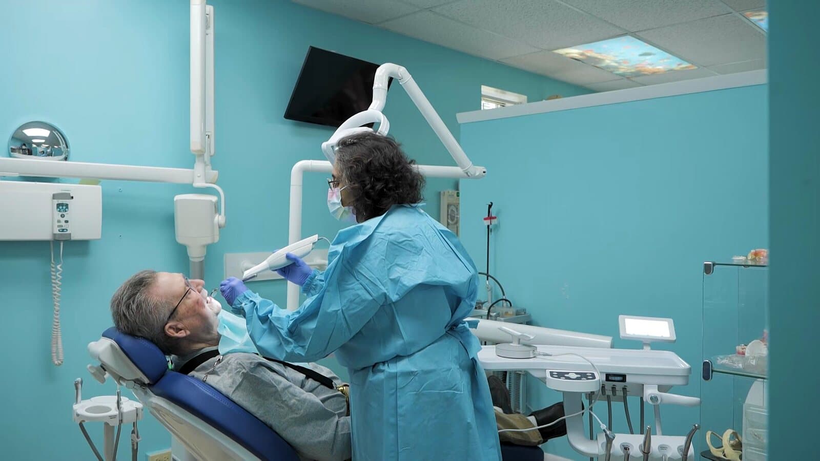 Dr. Raju treating a patient in a modern treatment room